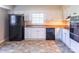 This functional kitchen features white cabinets, black appliances, and lots of counter space at 349 Dublin Ct, Gastonia, NC 28054