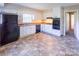 This functional kitchen features a tile floor, white cabinets, and black appliances at 349 Dublin Ct, Gastonia, NC 28054