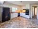 A practical kitchen with white cabinetry, black appliances and laminate flooring at 349 Dublin Ct, Gastonia, NC 28054