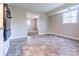 The kitchenette has a tile floor, a window, and an opening leading into another room at 349 Dublin Ct, Gastonia, NC 28054