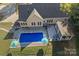 Aerial view of house, pool, deck, and surrounding landscape at 357 China Grove Rd, Kannapolis, NC 28083