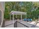 Covered deck with seating, grill, and fire pit at 357 China Grove Rd, Kannapolis, NC 28083