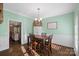 Dining room features a wooden table and chairs, and view of kitchen at 357 China Grove Rd, Kannapolis, NC 28083