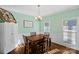 Formal dining room with light green walls and wooden table at 357 China Grove Rd, Kannapolis, NC 28083