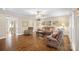 Bright living room with hardwood floors, comfortable seating, and a large TV at 357 China Grove Rd, Kannapolis, NC 28083