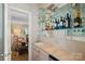 Wet bar with glass shelving, mirrored backsplash, and small sink at 357 China Grove Rd, Kannapolis, NC 28083