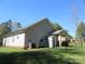 Expansive backyard with a shed, fenced perimeter, a covered porch, and mature trees, providing a serene outdoor retreat at 4986 6Th Sw St, Catawba, NC 28609