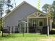 Spacious fenced backyard features a shed, covered patio, and lush lawn, offering privacy and room for outdoor activities at 4986 6Th Sw St, Catawba, NC 28609