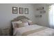 Bright bedroom with a decorative headboard, neutral colored bedding, and stylish wall art at 4986 6Th Sw St, Catawba, NC 28609