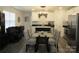 Elegant dining area with a black table, upholstered chairs, and views into the kitchen at 4986 6Th Sw St, Catawba, NC 28609