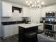 A well-equipped kitchen featuring black countertops, white cabinets, and stainless-steel appliances at 4986 6Th Sw St, Catawba, NC 28609