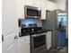 A kitchen with stainless steel appliances, white cabinets, and sleek countertops at 4986 6Th Sw St, Catawba, NC 28609