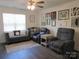 Cozy living room featuring comfortable seating, wood-look floors, and plentiful wall art at 4986 6Th Sw St, Catawba, NC 28609