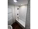 Clean, white tiled bathroom with subway tile and black fixtures at 7608 Kershaw Camden Hwy, Kershaw, SC 29067