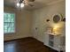 Bedroom with hardwood floors, ample lighting, and décor at 7608 Kershaw Camden Hwy, Kershaw, SC 29067