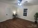 Bedroom showcasing wood floors, a window, and a table with plants and décor at 7608 Kershaw Camden Hwy, Kershaw, SC 29067