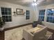Bright living room with multiple windows, hardwood floors, and an inviting seating arrangement at 7608 Kershaw Camden Hwy, Kershaw, SC 29067