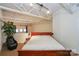 Spacious bedroom with a king-size bed and high ceilings at 929 Westmere Ave, Charlotte, NC 28208