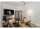 Home gym with various exercise equipment and a large TV at 929 Westmere Ave, Charlotte, NC 28208