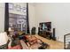 Living room with sectional sofa, large TV, and floor to ceiling windows at 929 Westmere Ave, Charlotte, NC 28208