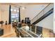 Open living area with a modern kitchen, high ceilings and a staircase at 929 Westmere Ave, Charlotte, NC 28208