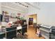 Home office with large desk, printer, and built-in shelving at 929 Westmere Ave, Charlotte, NC 28208