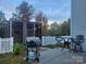 Landscaped backyard with patio, outdoor seating, and a grill, perfect for gatherings at 1176 Whitehall Hill Rd, York, SC 29745