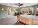 Bright bedroom with large windows, wooden furniture, and a view of the outdoors at 1176 Whitehall Hill Rd, York, SC 29745