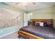 Comfortable bedroom with a rustic wood headboard, plush bedding, and a neutral color palette at 1176 Whitehall Hill Rd, York, SC 29745