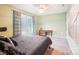 Comfortable bedroom with neutral walls and a large window providing natural light at 1176 Whitehall Hill Rd, York, SC 29745
