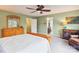 Spacious bedroom featuring a wooden dresser, a leather chair, and access to an ensuite bathroom at 1176 Whitehall Hill Rd, York, SC 29745