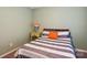 Bedroom featuring a striped gray and white duvet cover and yellow side table with lamp at 1176 Whitehall Hill Rd, York, SC 29745