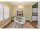 Inviting dining room with a glass table, white chairs, a patterned rug, and stylish decor at 1176 Whitehall Hill Rd, York, SC 29745