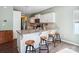 Modern kitchen features white cabinets, granite countertops, and a breakfast bar at 1176 Whitehall Hill Rd, York, SC 29745