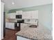 This updated kitchen features stainless steel appliances and a breakfast bar at 1176 Whitehall Hill Rd, York, SC 29745
