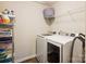 Bright, efficient laundry room featuring new appliances and plenty of storage shelves at 1176 Whitehall Hill Rd, York, SC 29745