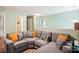 Comfortable upstairs loft with a large sectional couch and bright orange pillows at 1176 Whitehall Hill Rd, York, SC 29745