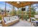 Comfortable screened porch has seating and views of the private wooded backyard at 1176 Whitehall Hill Rd, York, SC 29745