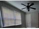 Functional bedroom featuring blinds, a ceiling fan, and access to a door at 3337 Eastway Dr, Charlotte, NC 28205