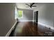 Bedroom featuring hardwood floors, neutral paint, and ample closet space at 3337 Eastway Dr, Charlotte, NC 28205