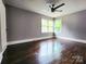 Bright bedroom with hardwood floors and a large window at 3337 Eastway Dr, Charlotte, NC 28205