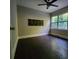 Well-lit bedroom with hardwood floors, a ceiling fan, and natural light from the window at 3337 Eastway Dr, Charlotte, NC 28205