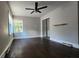 Spacious bedroom featuring hardwood floors, a ceiling fan, and ample natural light at 3337 Eastway Dr, Charlotte, NC 28205