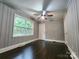 Bedroom features hardwood floors, neutral paint, and natural light at 3337 Eastway Dr, Charlotte, NC 28205
