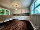 Bright dining room featuring beautiful wood floors and elegant built-in cabinetry at 3337 Eastway Dr, Charlotte, NC 28205