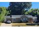 Charming brick home featuring a well-maintained front yard and a cozy, inviting entrance at 3337 Eastway Dr, Charlotte, NC 28205
