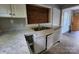 Classic kitchen featuring light countertops, white cabinets, and stainless steel sink at 3337 Eastway Dr, Charlotte, NC 28205