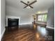 Inviting living room boasts a decorative fireplace and gleaming hardwood floors at 3337 Eastway Dr, Charlotte, NC 28205