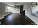 Bright living room showcasing a decorative fireplace, ceiling fan, and light walls at 3337 Eastway Dr, Charlotte, NC 28205