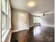 Spacious living room with hardwood floors and ample natural light at 3337 Eastway Dr, Charlotte, NC 28205